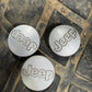 OEM Used Set of 3 1997-2006 Jeep Cherokee Wrangler Silver Center Caps 5DY07TRMAB