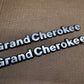 93-98 Jeep Grand Cherokee OEM 55295445 Metal Emblem Pair Set Front Fender Badge